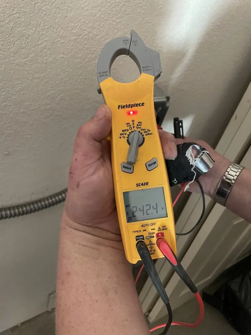 Voltage testing with clamp meter during Electrical Installation Services in Daytona Beach Shores
